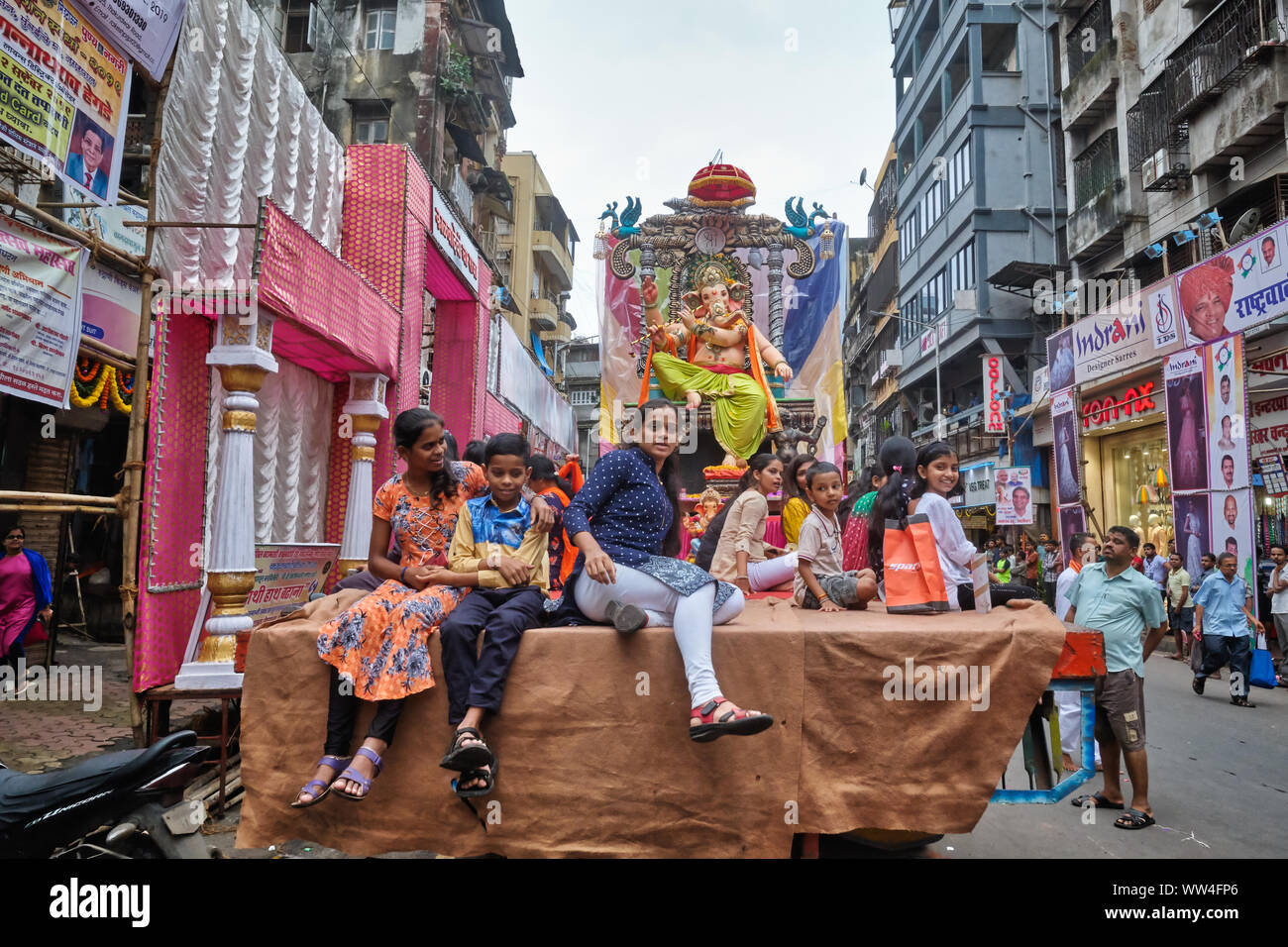 During the Ganesh Festival procession in Mumbai, India, worshippers of