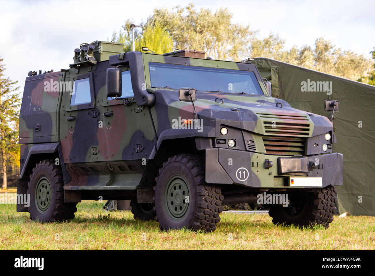 Wheeled armoured vehicle from german army stands on a field Stock Photo