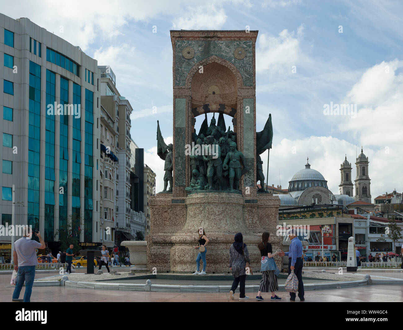 TAKSIM, BEYOGLU, ISTANBUL, TURKEY - SEPTEMBER, 12, 2019; Taksim Square and istiklal street. People walk around Republic Monument at Taksim Stock Photo