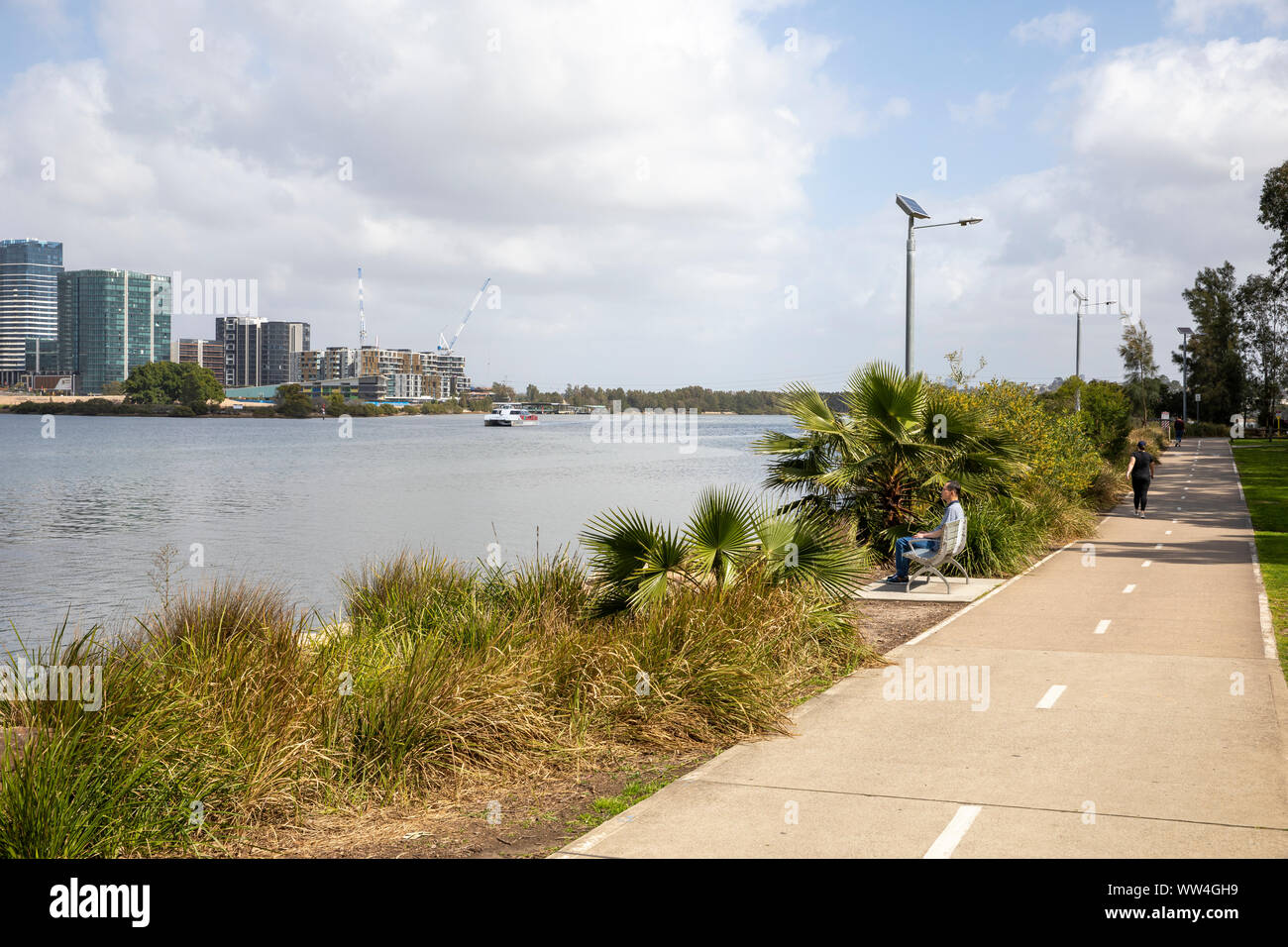 Meadowbank in Sydney, Memorial Park beside the Parramatta river, wentworth point suburb in the distance,Sydney,Australia Stock Photo
