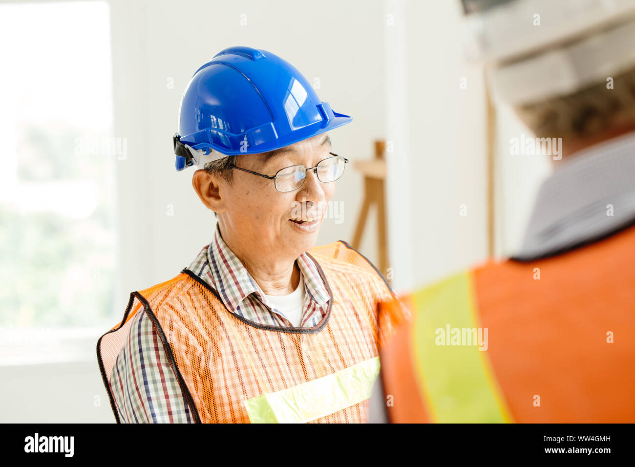 Happy professional worker working together home builder architecture mix race in construction site Stock Photo
