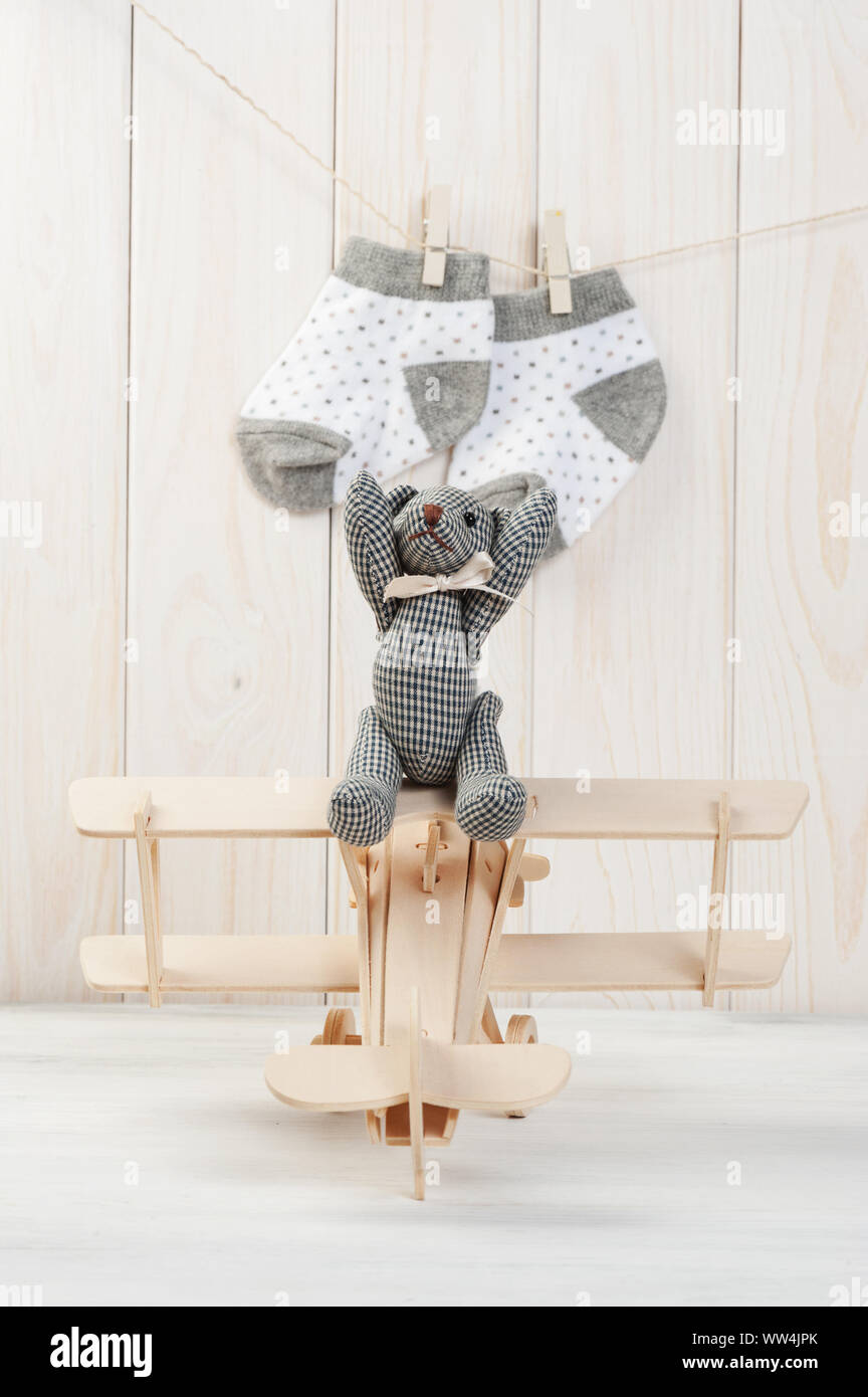 Cute teddy bear on wooden background with wooden baby toys Stock Photo ...