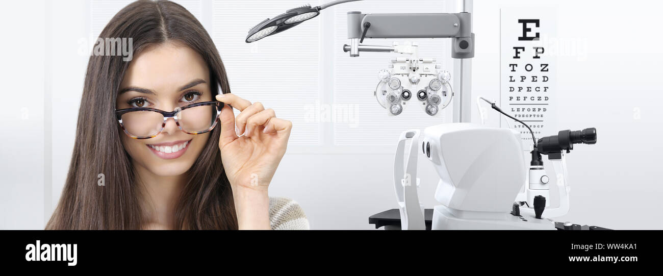 concept of eye examination, woman patient smiling with spectacles
