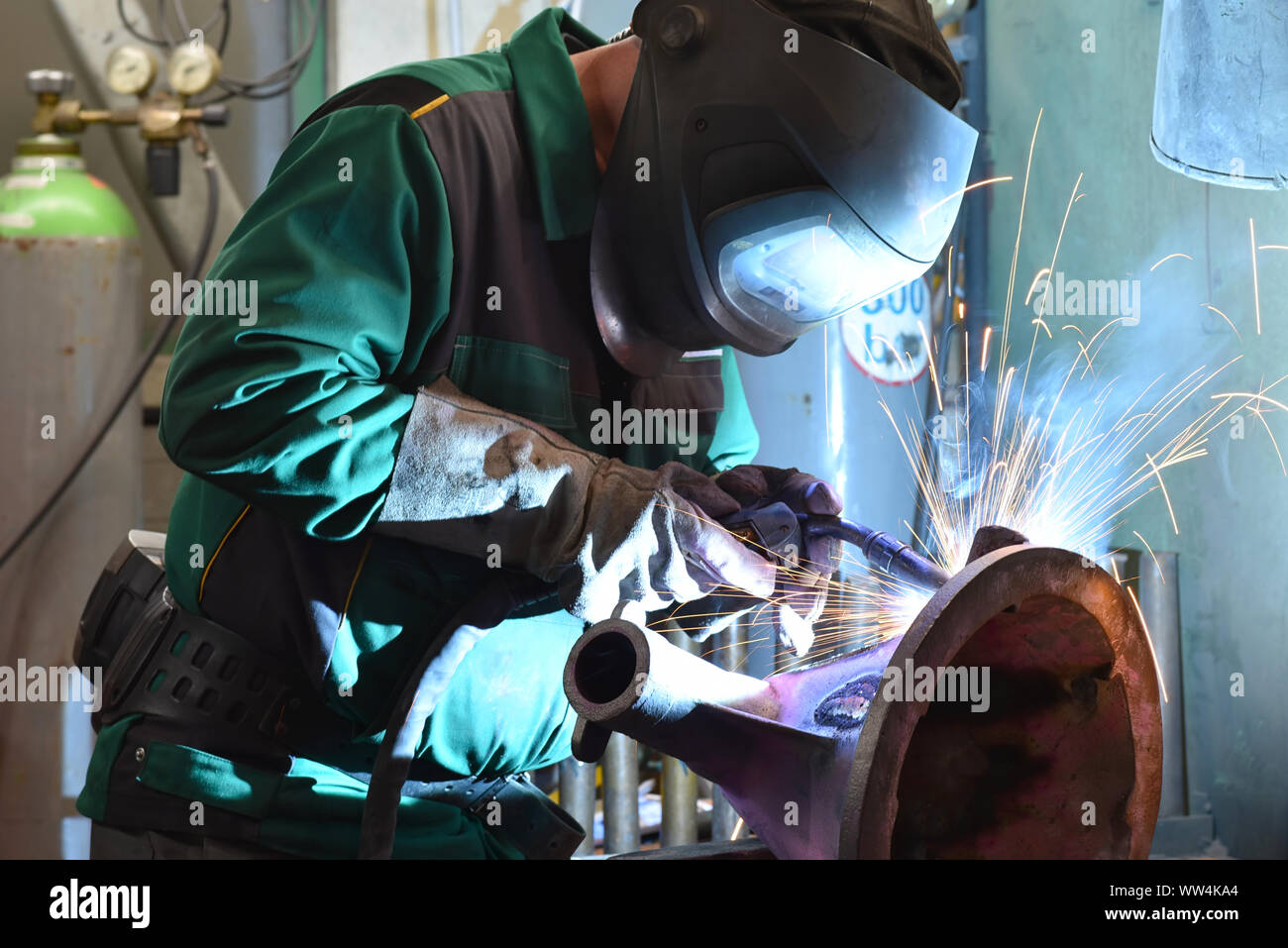welder at work in an industrial company Stock Photo