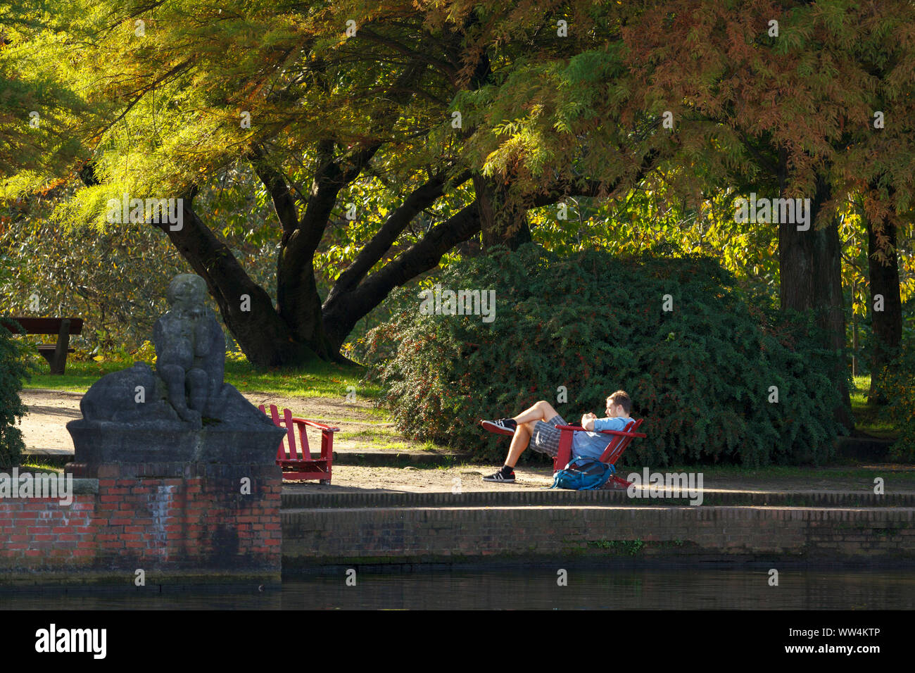 Relaxation on the shore of town park lake in Hamburg Winterhude. Stock Photo