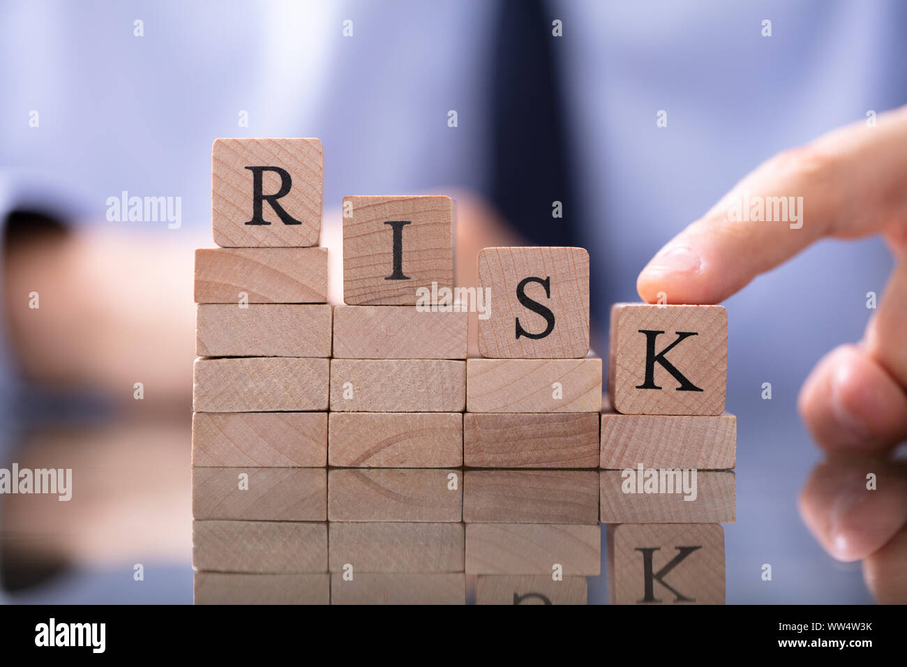 Risk Word And Man Pushing Down Chart Stock Photo