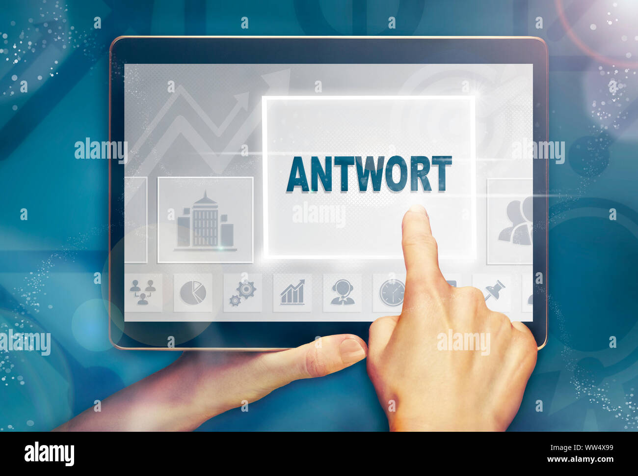 A businessman pressing a Answer "Antwort" button in German on a futuristic computer  display Stock Photo