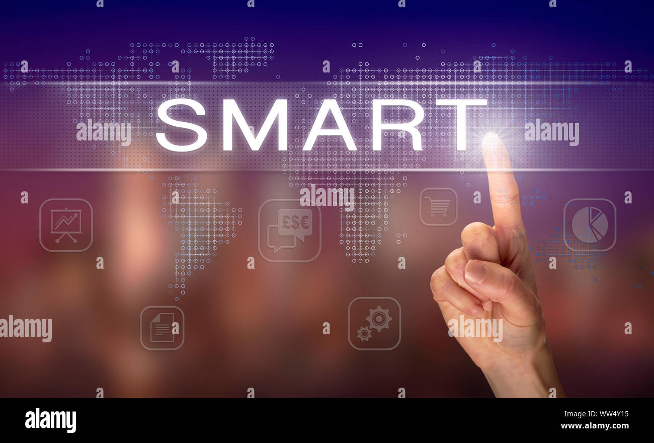 A hand selecting a SMART business concept on a clear screen with a ...