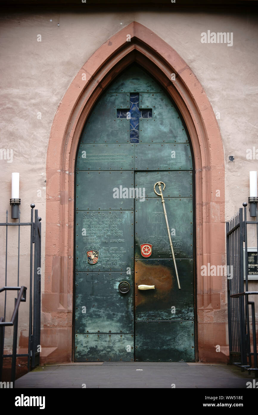 Mainz, Germany, iron door of the entrance to the St. Stephan church with engraved Latin words Stock Photo