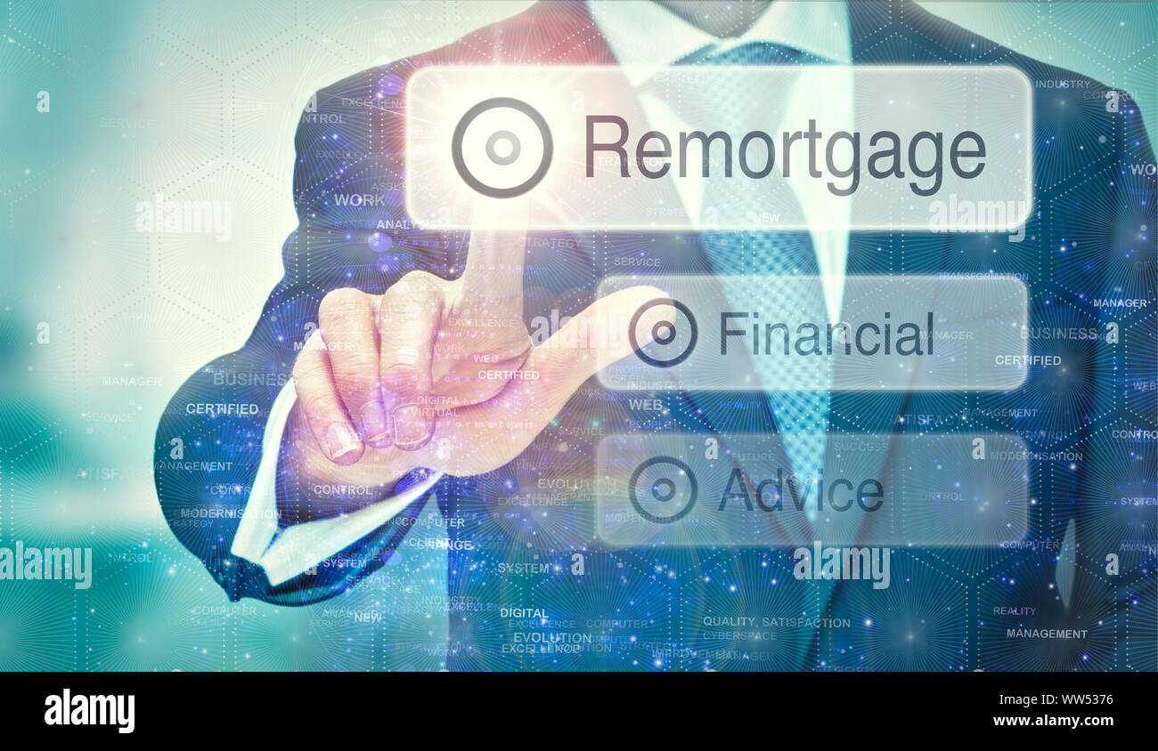 A business man selection a Remortgage button on a futuristic display with a concept written on it. Stock Photo