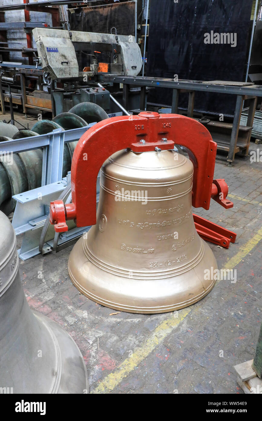 A decorative commemorative bell awaiting shipment to Sri Lanka at the John Taylor & Company Bell Foundry, Loughborough, Leicestershire, England, UK Stock Photo