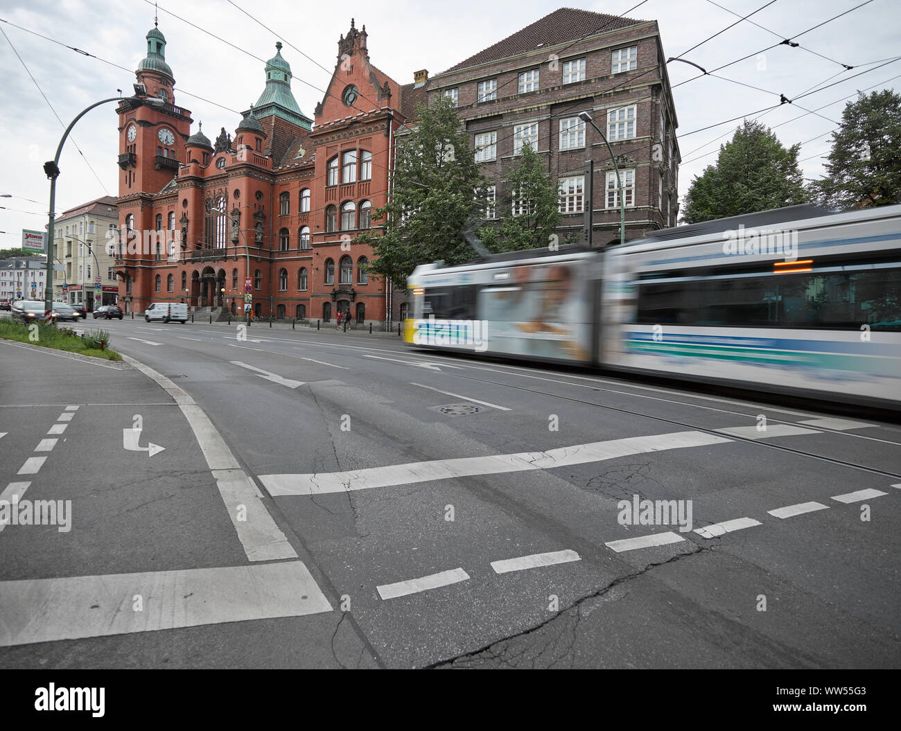 Streetcar moving in front of city hall Pankow Stock Photo