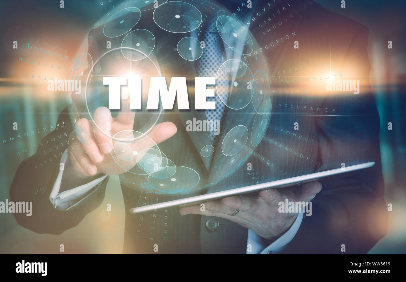 A hand selecting a Time business concept on a futuristic computer display. Stock Photo