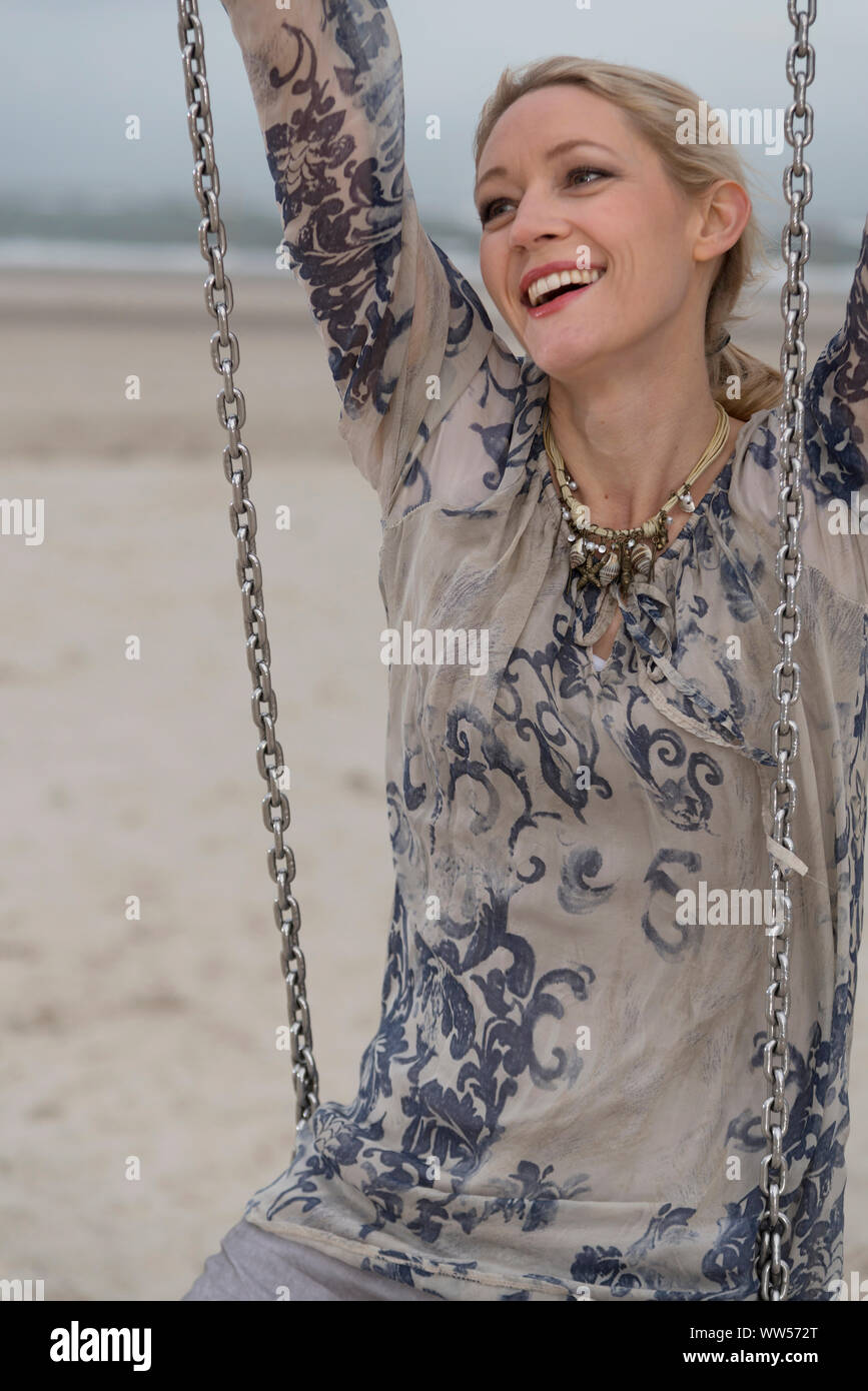 Old woman on beach hi-res stock photography and images - Alamy