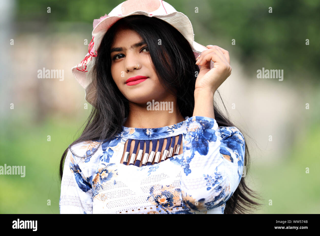Portrait of teenage girl with hat Stock Photo - Alamy
