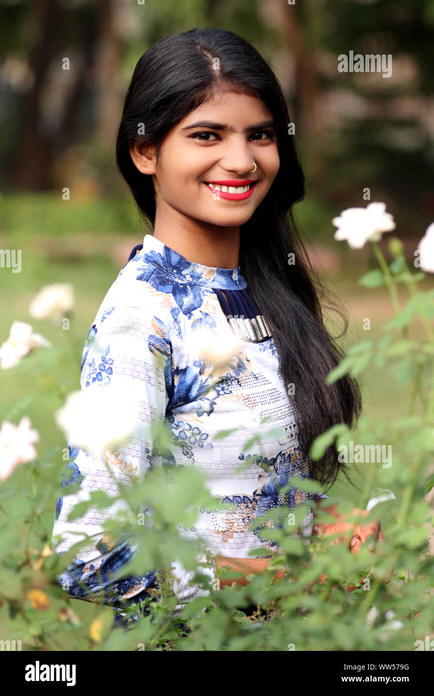 Cheerful teenage girl standing portrait Stock Photo - Alamy
