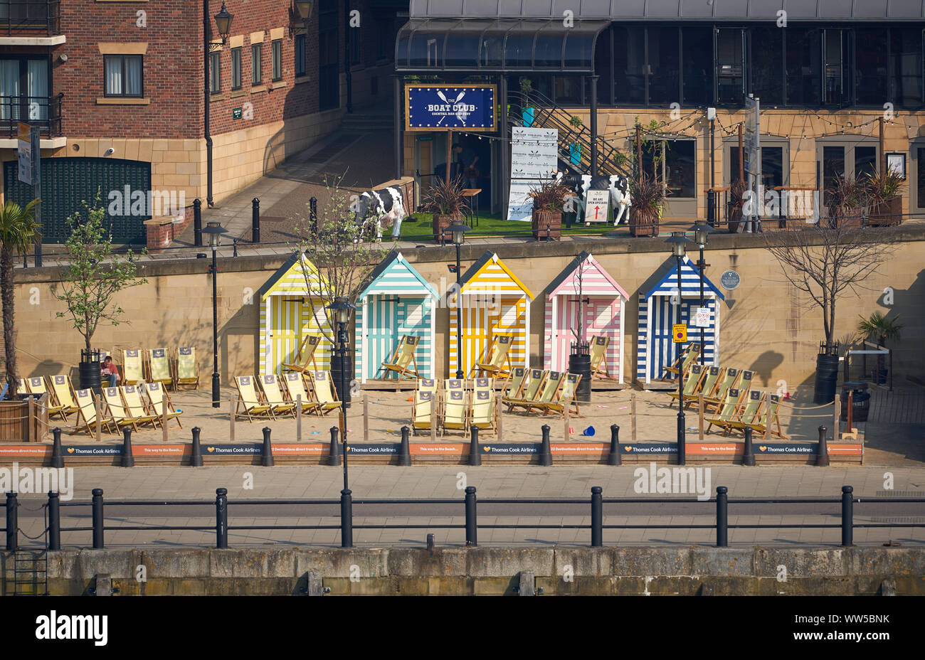 NEWCASTLE UPON TYNE, ENGLAND, UK - MAY 08, 2018: Thomas Cook's manmade Seaside with sand beach, deckchairs and colourful beach huts Stock Photo
