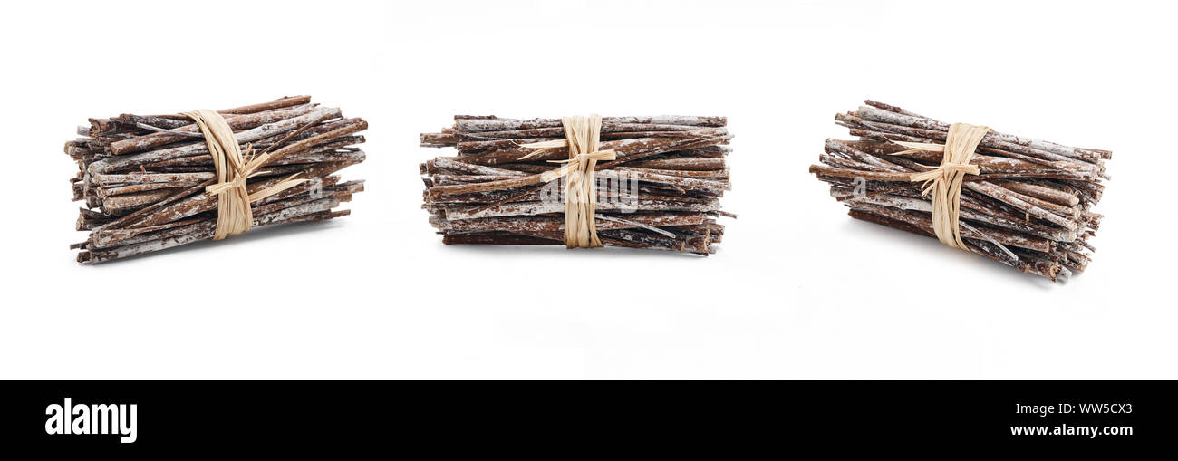 Side view of dry twigs tied in a bundle with natural twine isolated on