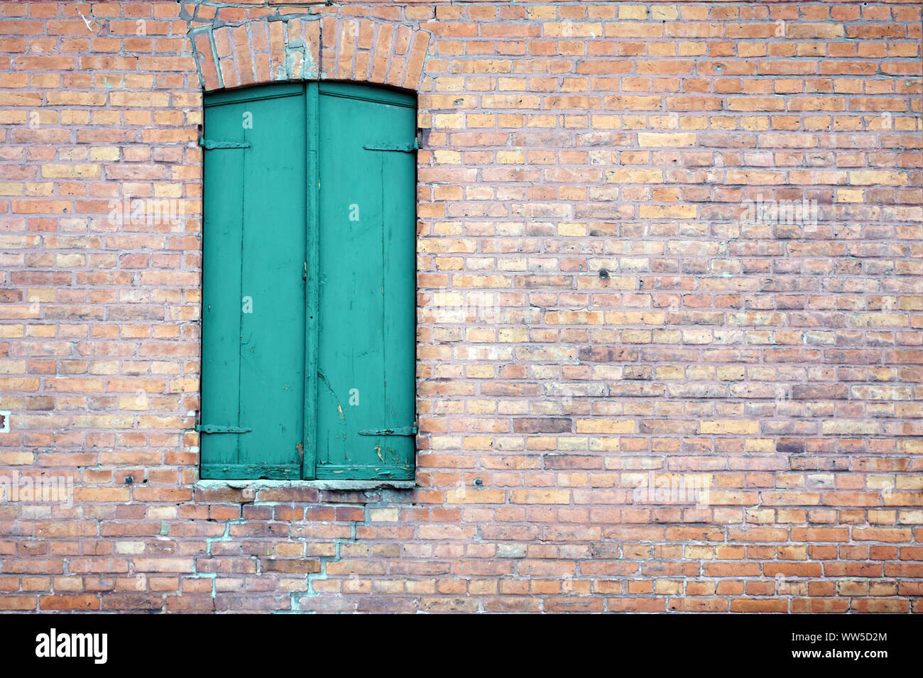 Photography of an old wooden window at a brick building Stock Photo - Alamy