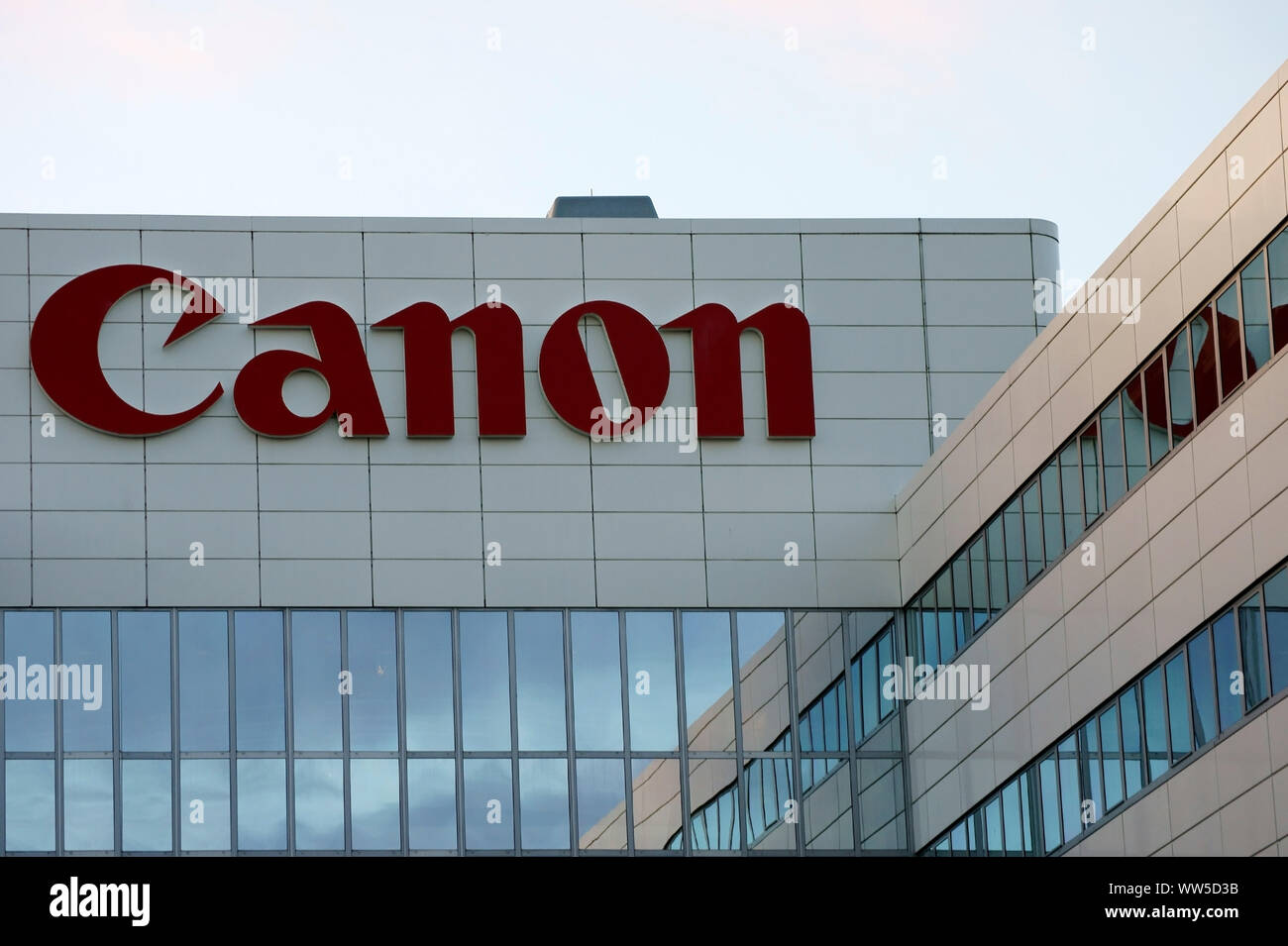The logo of the company Canon at a modern facade cladding of a store building in Amsterdam, Stock Photo