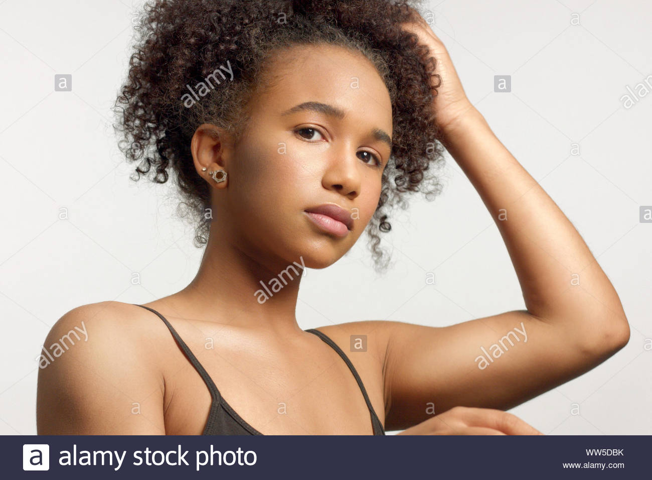 Closeup Portrait Of Young Mixed Race Model With Curly Hair In