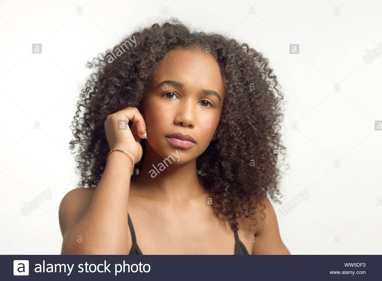 Closeup Portrait Of Young Mixed Race Model With Curly Hair In