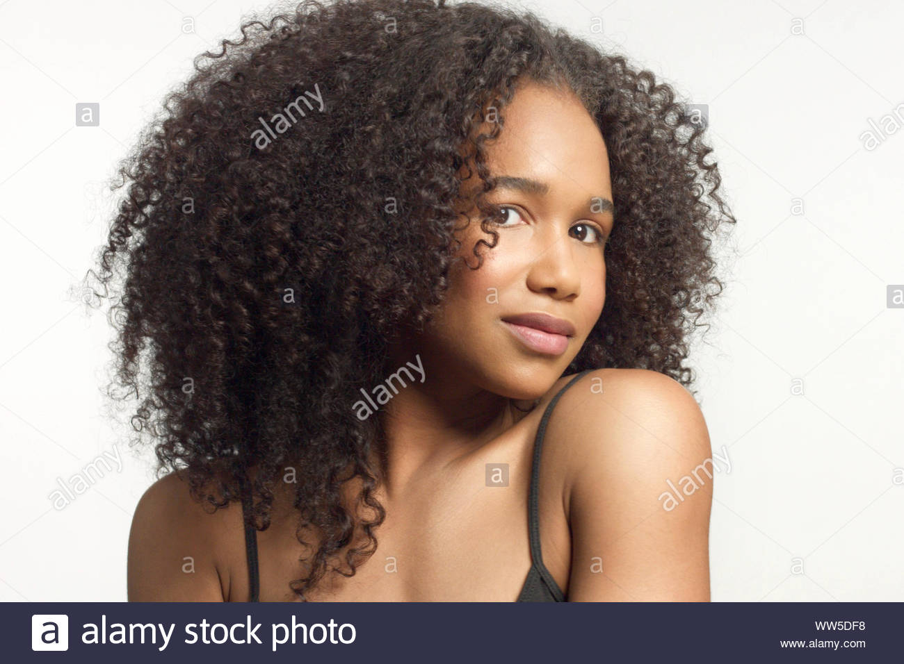 Closeup Portrait Of Young Mixed Race Model With Curly Hair In