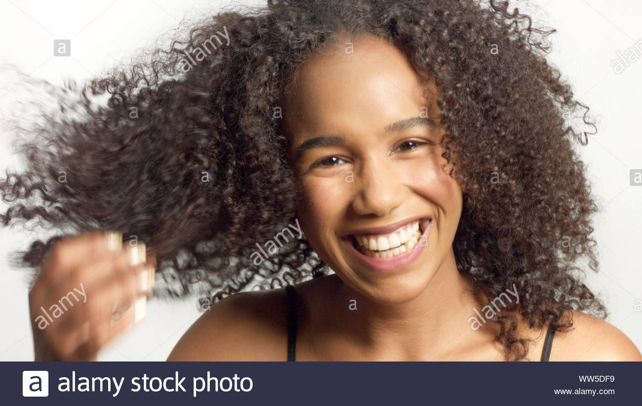 Closeup Portrait Of Young Mixed Race Model With Curly Hair In