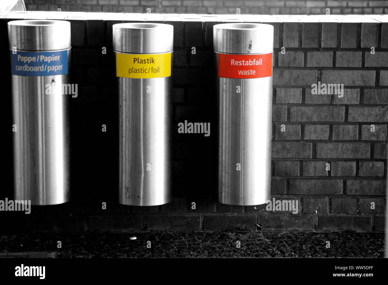Three refuse bins from stainless steel side by side for different sorts