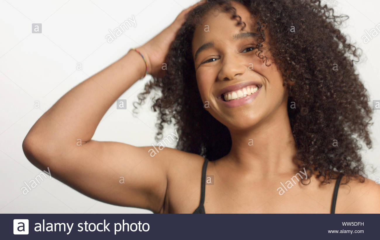 Closeup Portrait Of Young Mixed Race Model With Curly Hair In