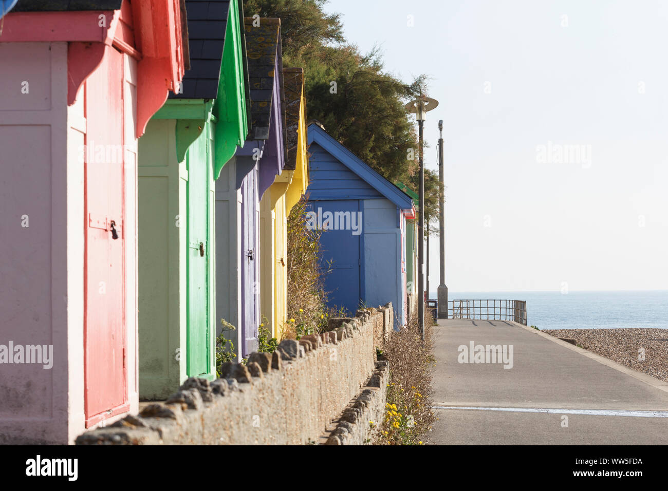 Coloured small bath houses on the English coast close to Folkstone, Stock Photo