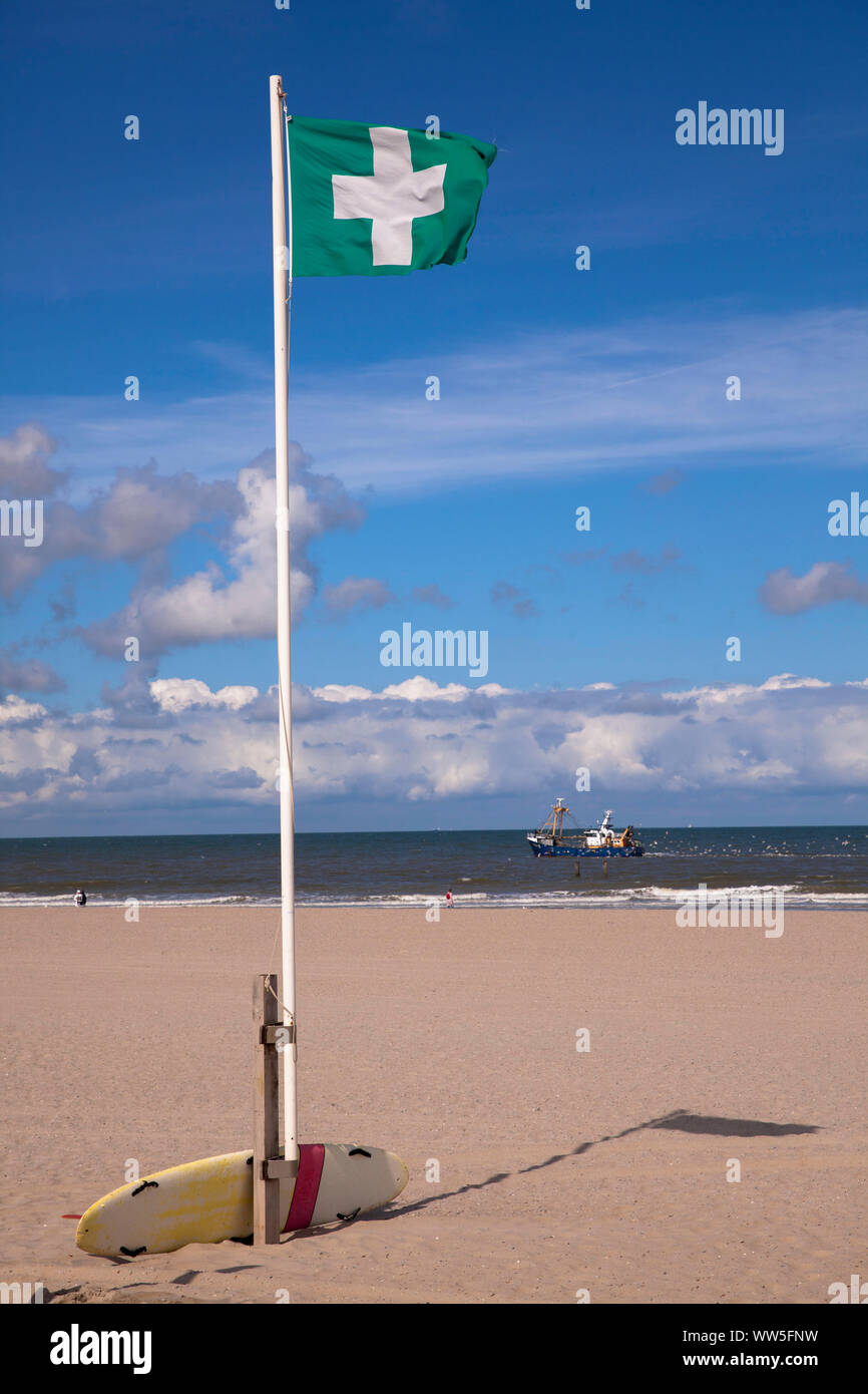 flag with first aid rescue sign on the beach of Domburg on the peninsular Walcheren, Zeeland, Netherlands.   Fahne mit Erste-Hilfe-Rettungszeichen am Stock Photo
