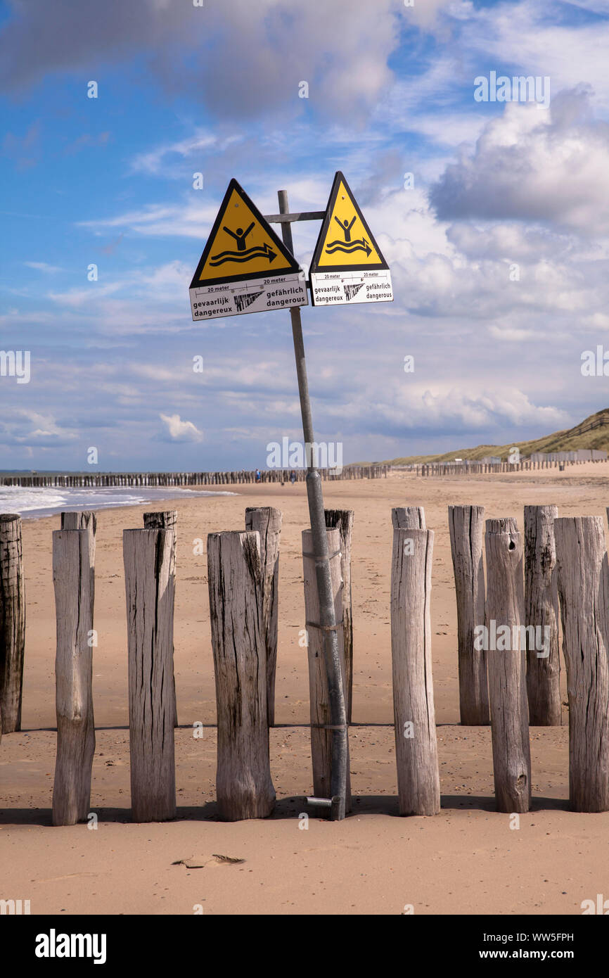 signs warns swimmers of groynes in the water, the beach in Domburg on the peninsula Walcheren, Zeeland, Netherlands.  Schild warnt Schwimmer vor Buhne Stock Photo