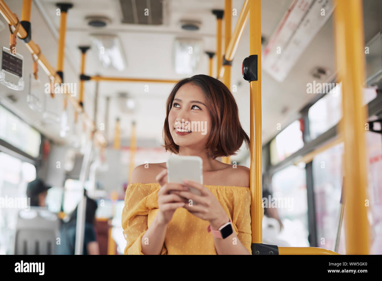 The passenger use smartphone in the bus or train, technology lifestyle, transportation and traveling concept Stock Photo