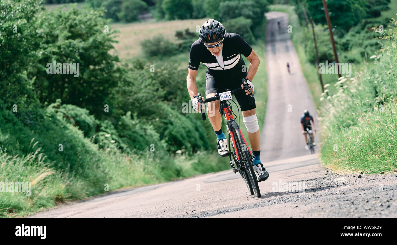 ROTHBURY, NEWCASTLE UPON TYNE, ENGLAND, UK - JULY 06, 2019: An elderly ...
