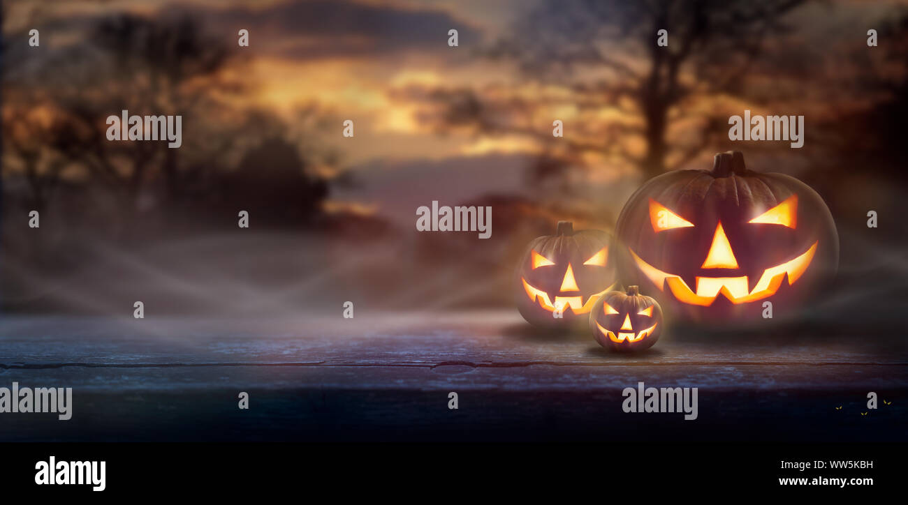 Mist rolling in over the spooky glow of Jack O' Lanterns on the right ...
