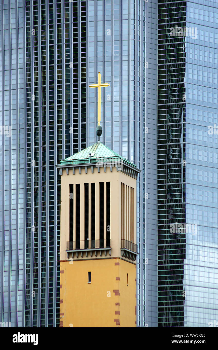 Photography of a steeple point, St. Catherine's Church, in front of a multistoried high rise, Stock Photo