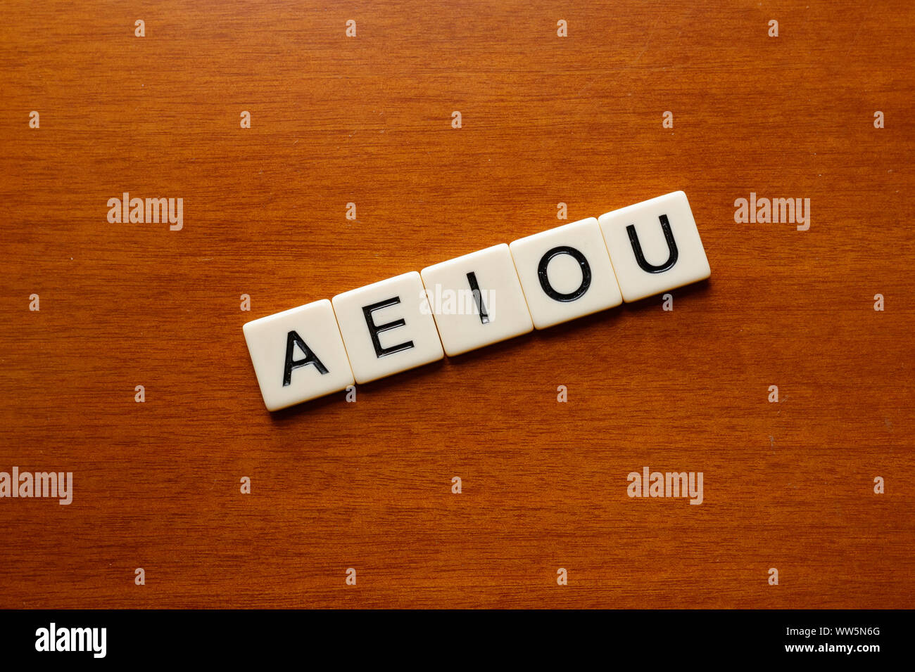 Cambre / Spain - April 18 2019: AEIOU vowel letters on a wood table Stock Photo