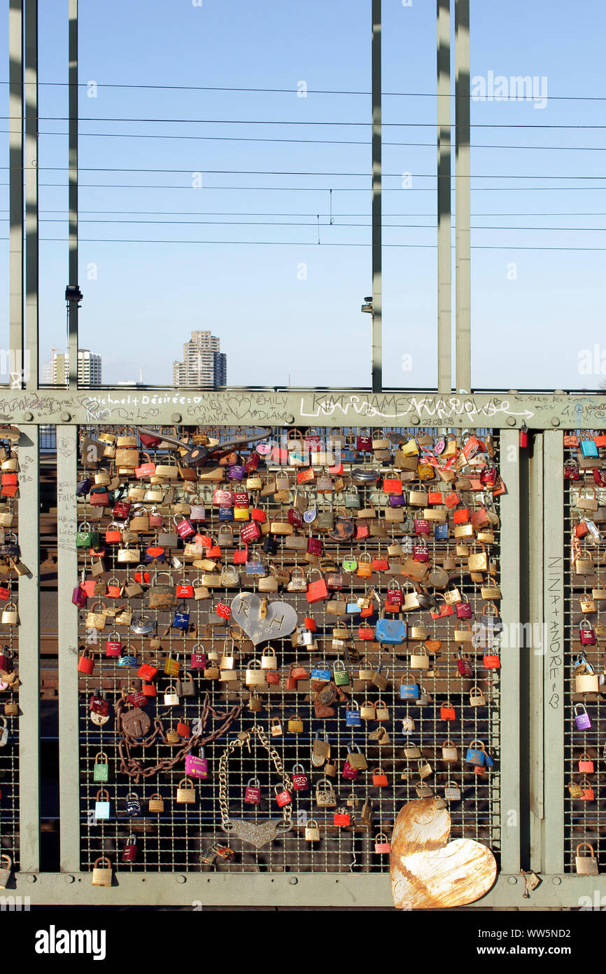 Love locks, chains and hearts at the fence of the Hohenzollern Bridge in Cologne, Stock Photo