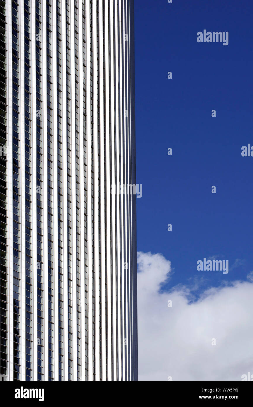 Photography of a high rise facade in backlight with clouds and sky, Stock Photo