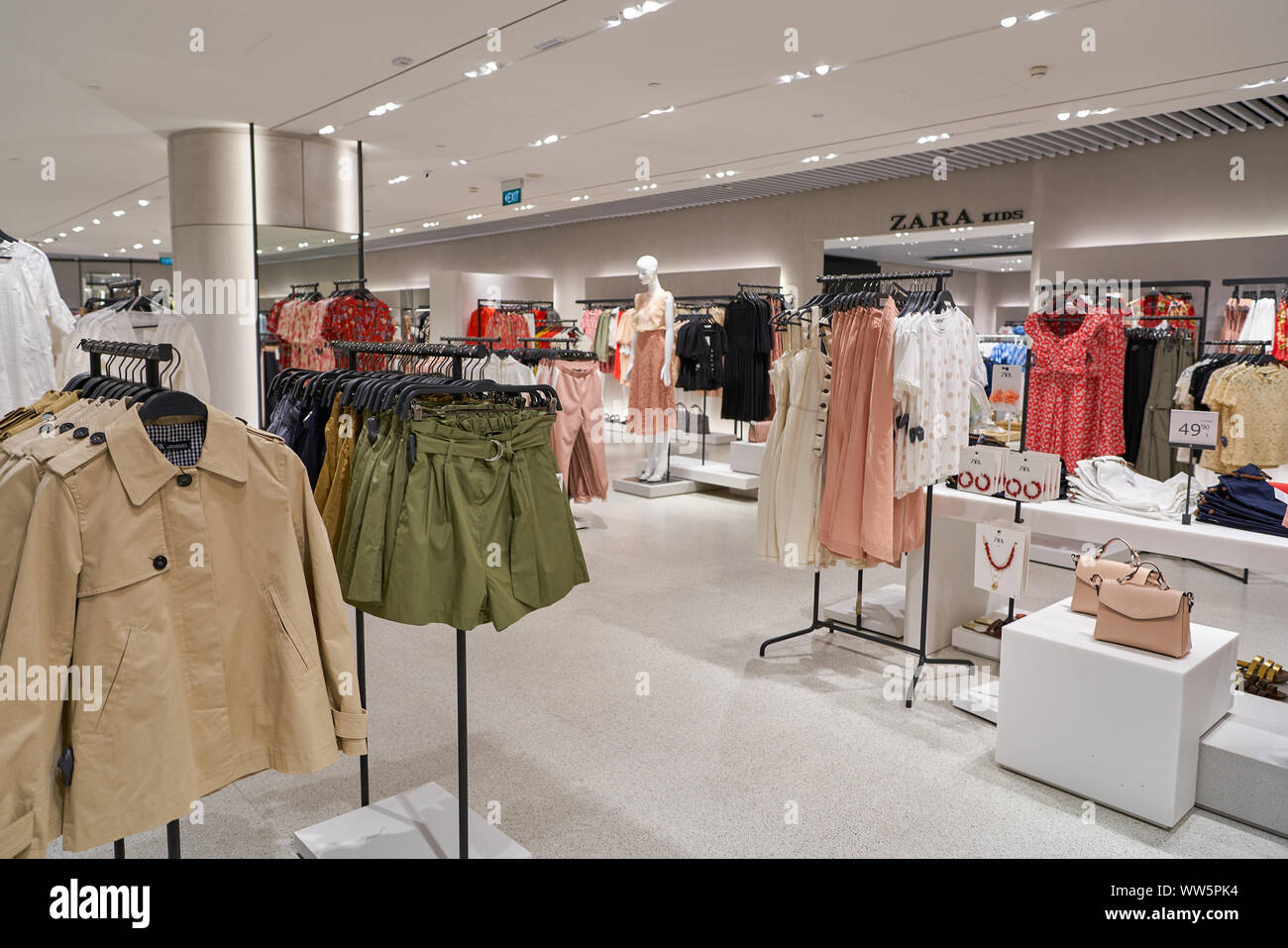 SINGAPORE - CIRCA APRIL, 2019: clothes on display at Zara store in the  Shoppes at Marina Bay Sands Stock Photo - Alamy