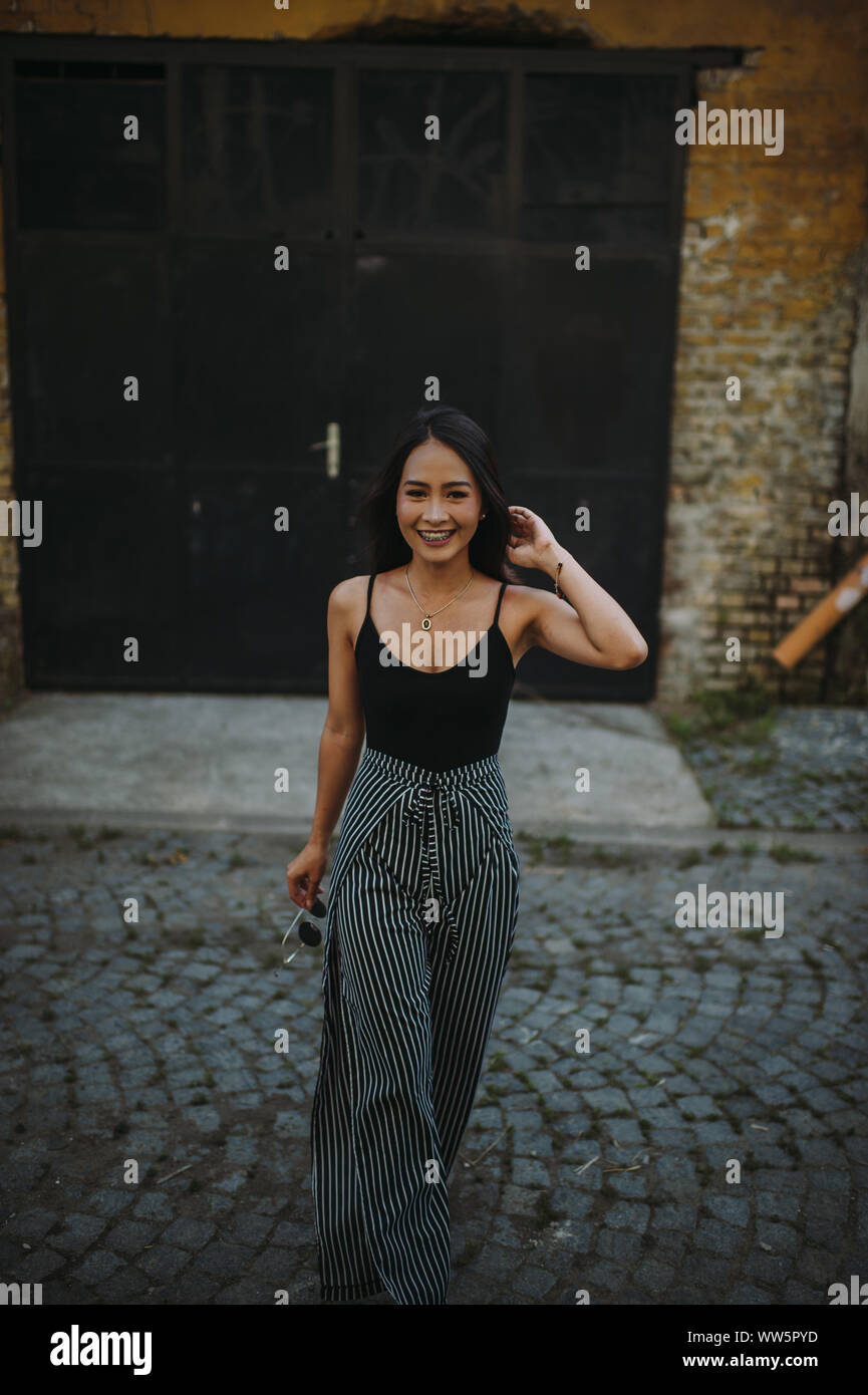 Beautiful woman walking street hi-res stock photography and images - Alamy