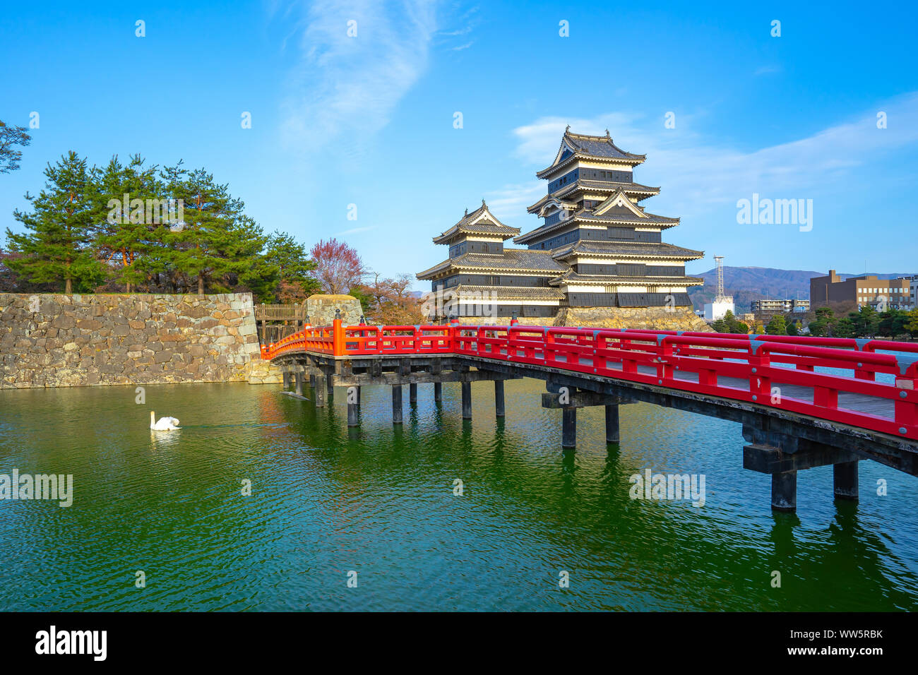 View of Matsumoto Castle with red bridge in Nagano, Japan. Stock Photo