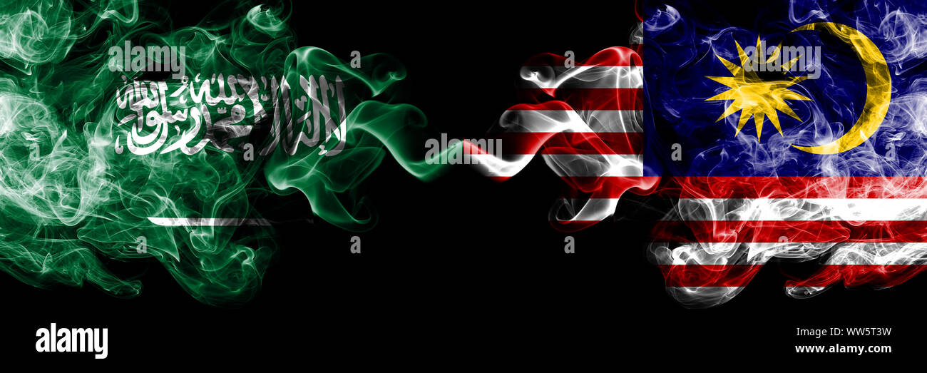 Saudi Arabia Kingdom vs Malaysia, Malaysian smoky mystic flags placed side by side. Thick colored silky smoke flags of Arabic, Arabian and Malaysia, M Stock Photo