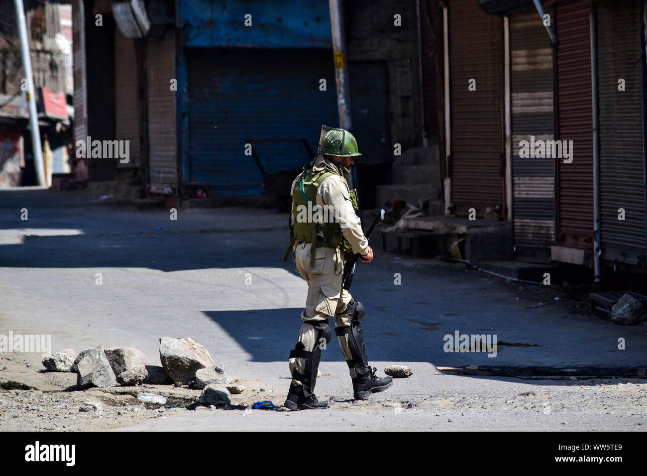 Kashmir, India. 13th Sep, 2019. A paramilitary trooper patrols during restrictions in Srinagar, Kashmir. Kashmir valley remained shut for the 40th consecutive day following the scrapping of Article 370 by the central government which grants special status to Jammu & Kashmir. Credit: SOPA Images Limited/Alamy Live News Stock Photo