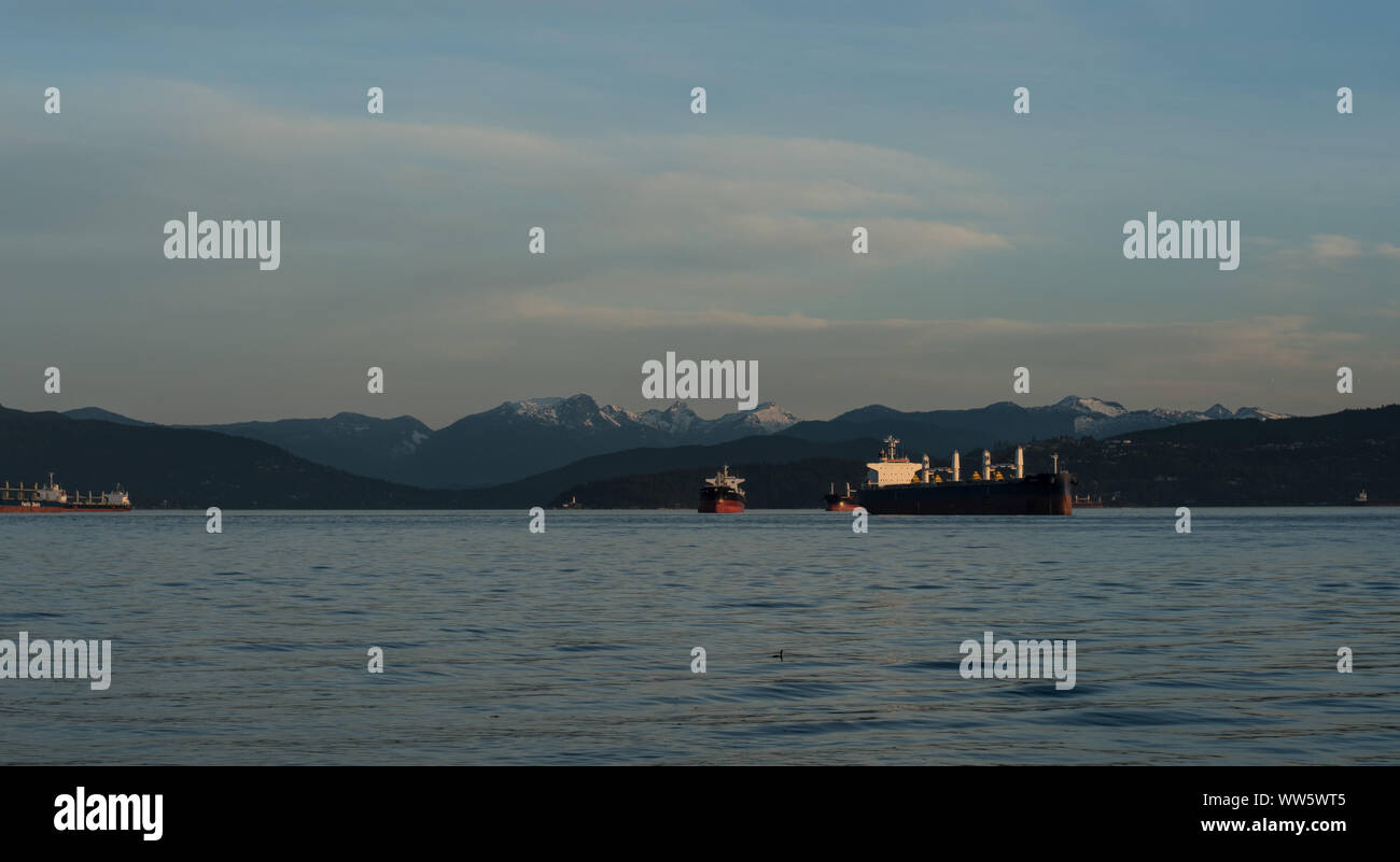 Container ships lying in the English Bay, the bay of Vancouver, Stock Photo
