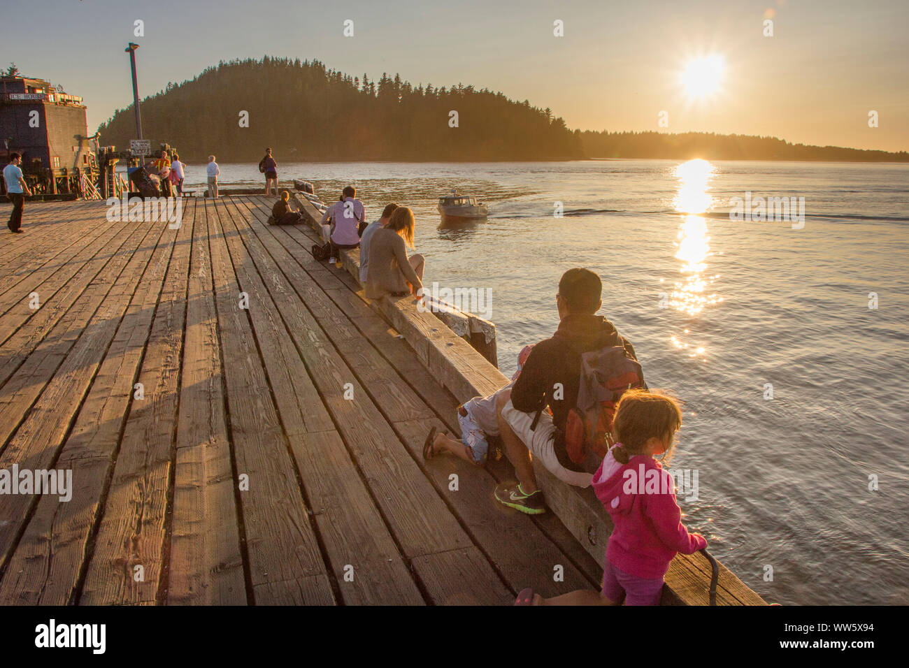 Evening mood at a jetty with people, Vancouver Island Stock Photo