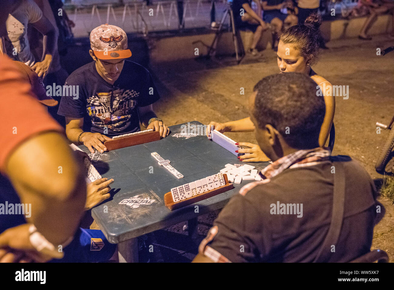 Dominoes player at night on the churchyard of ViÃ±ales, Pinar del Rio, Cuba Stock Photo