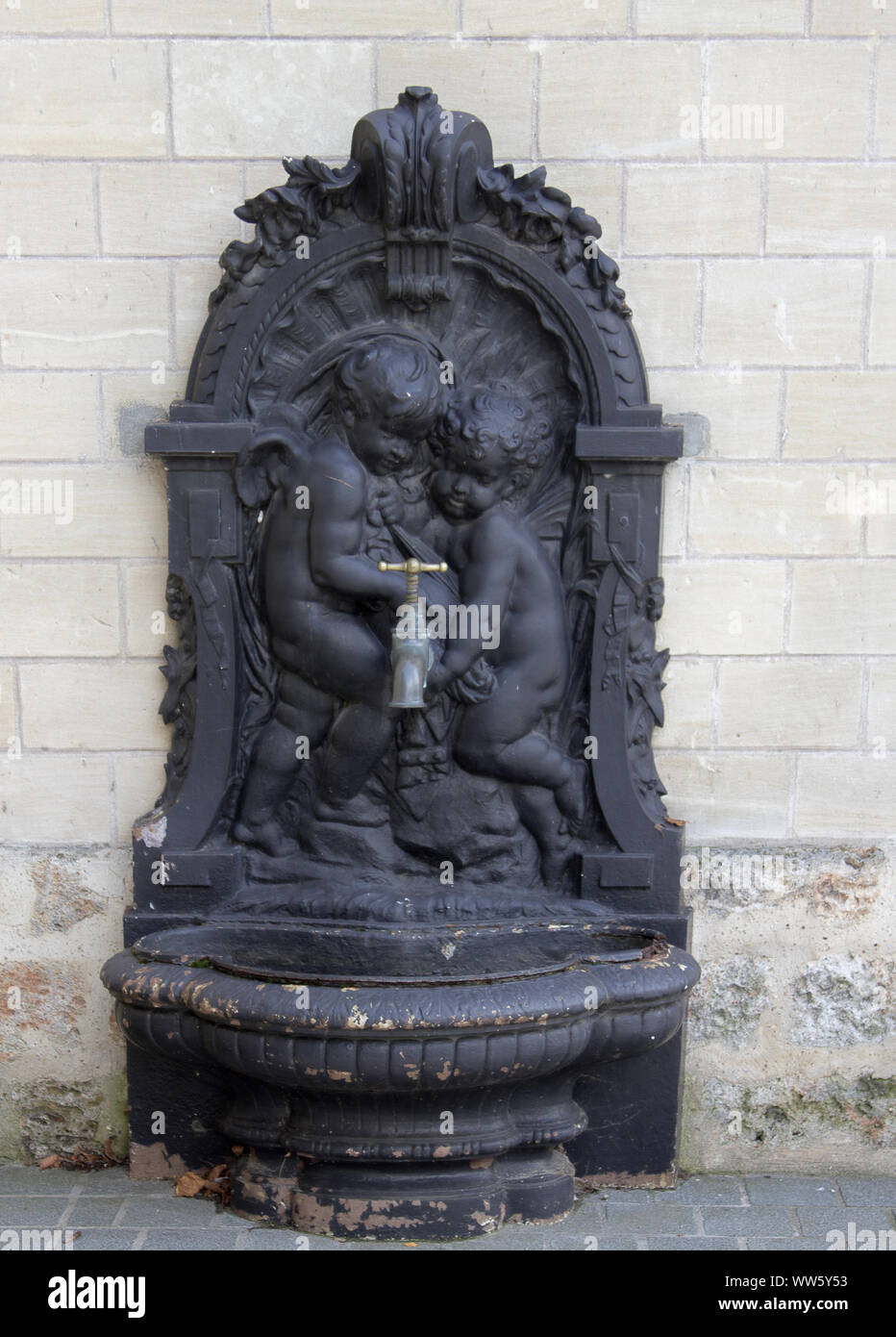 Street water pipe (faucet) with bronze sculpture of angelets, cupids