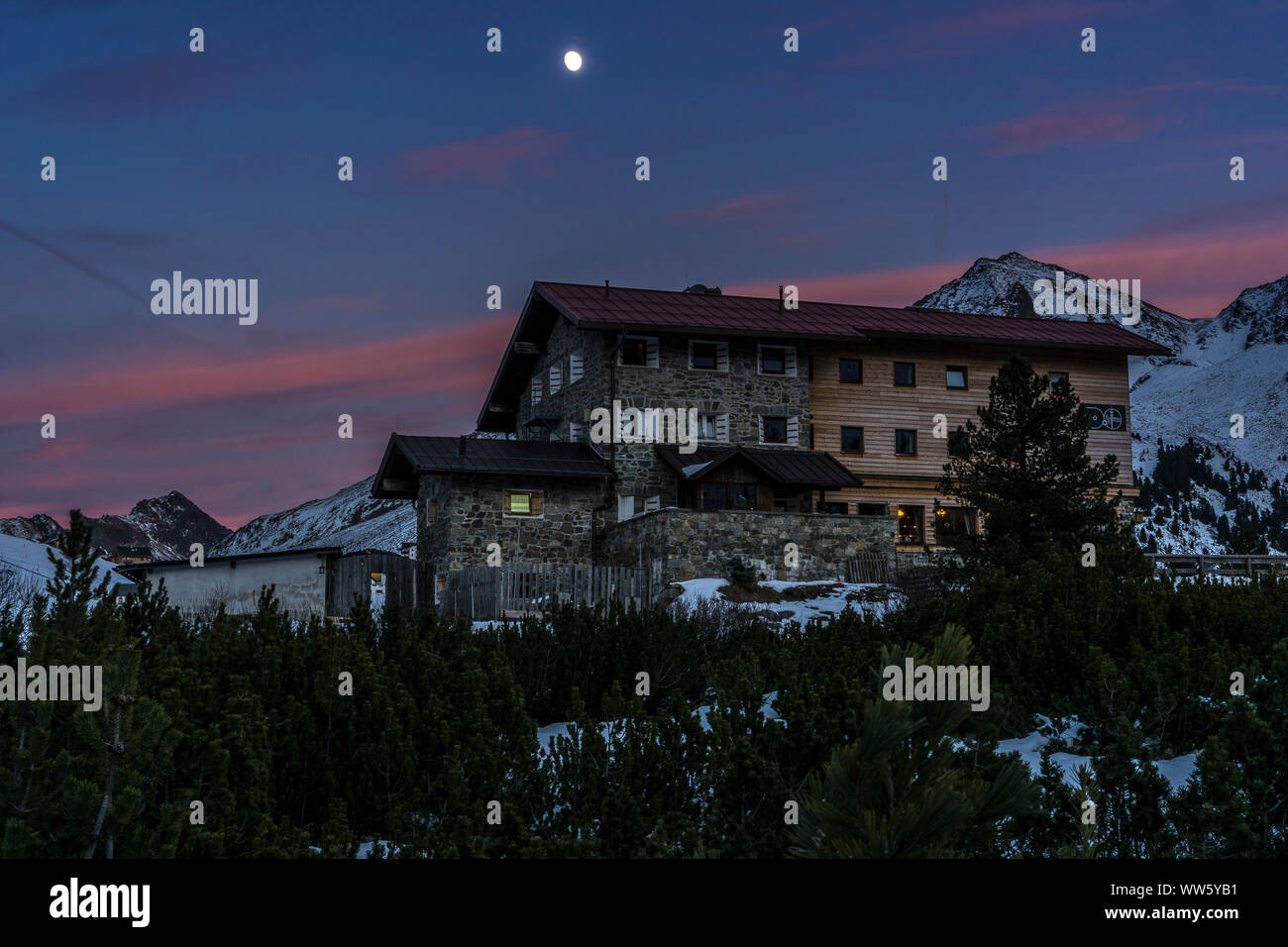 Austria, Tyrol, Sellrain, KÃ¼htai, Dortmund hut in KÃ¼htai with full moon and sundown Stock Photo